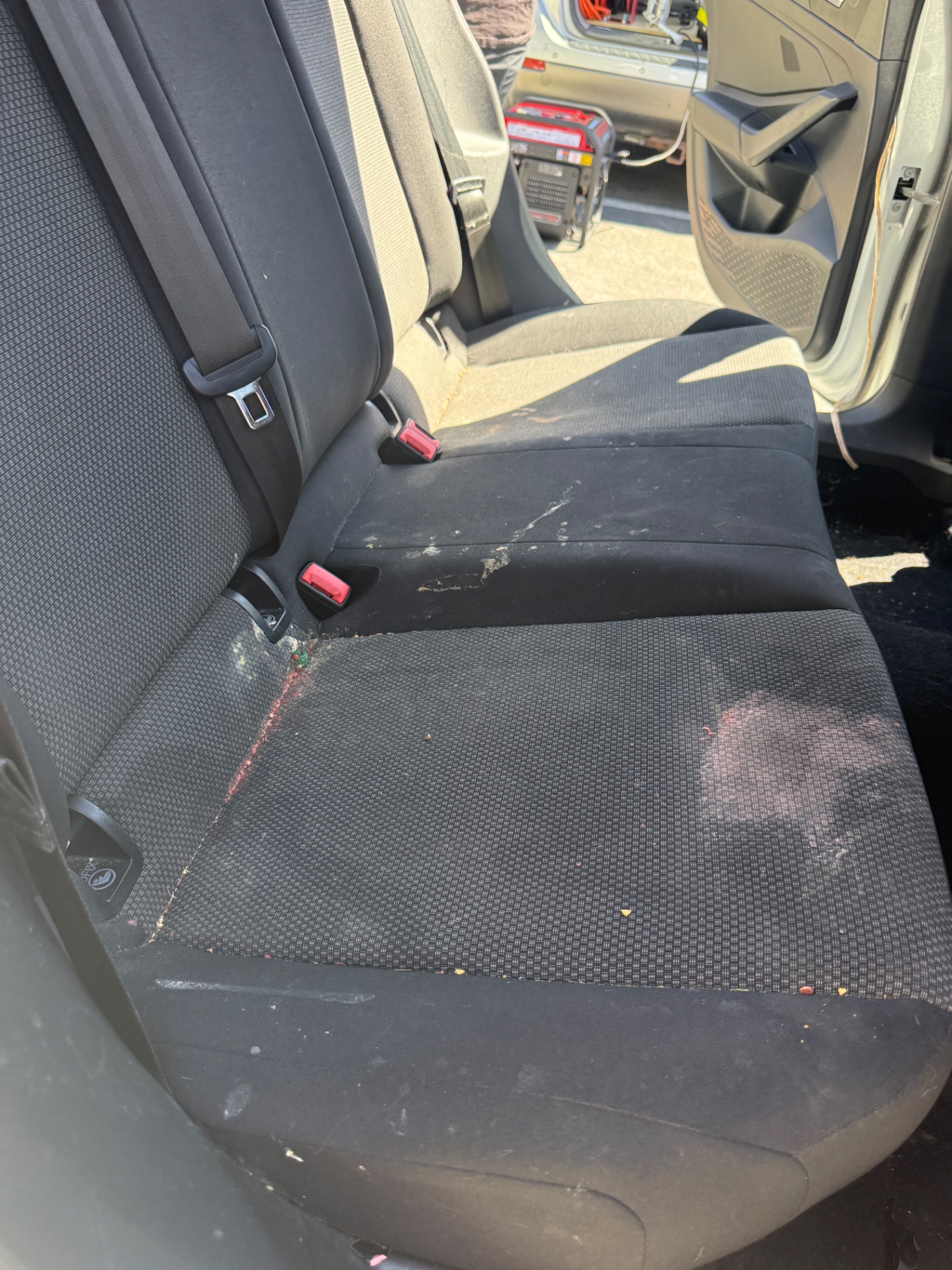 Rear car seats before and after a deep clean and extraction — before