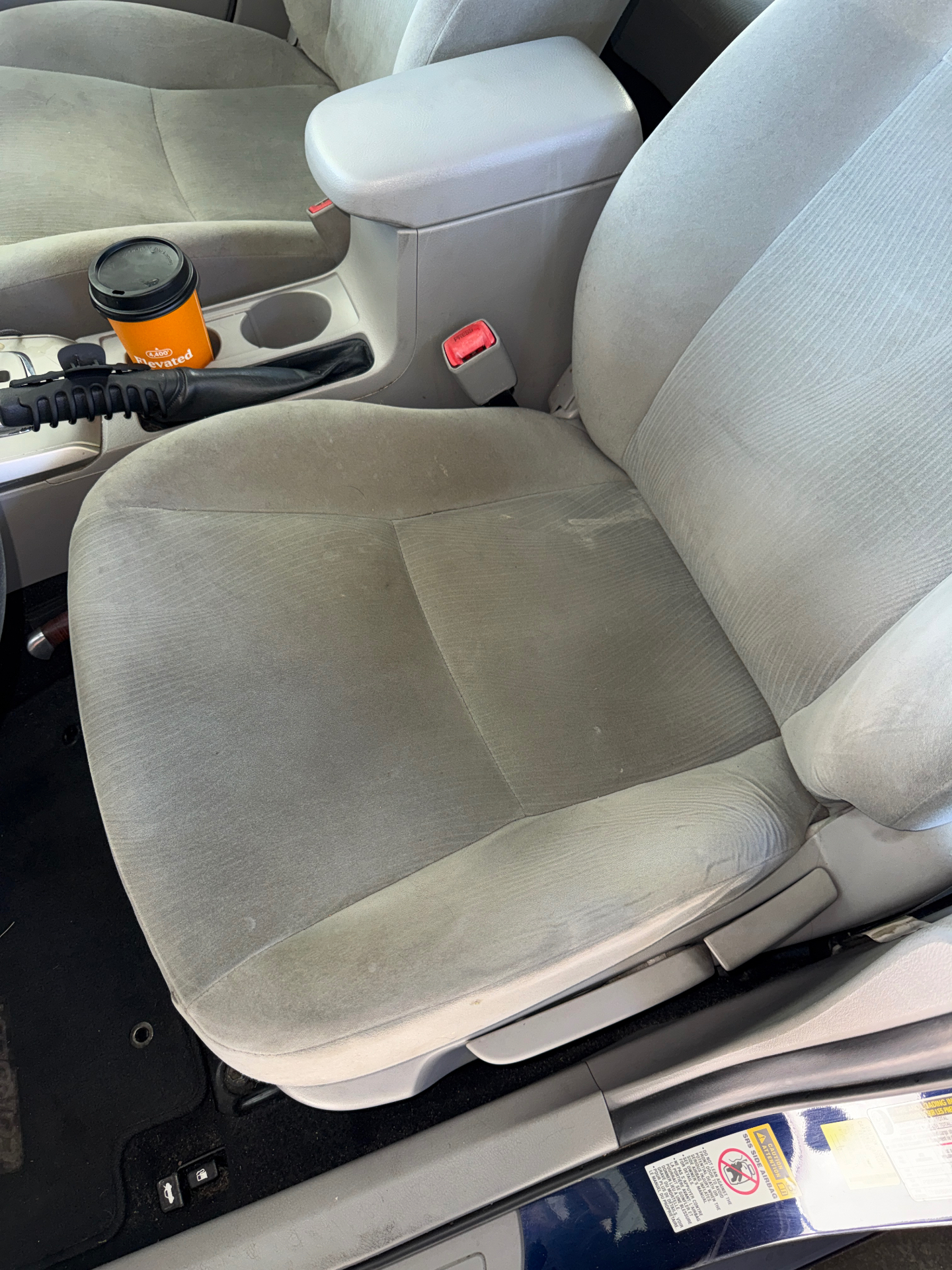 Customer car seat before and after shampoo and extraction — before