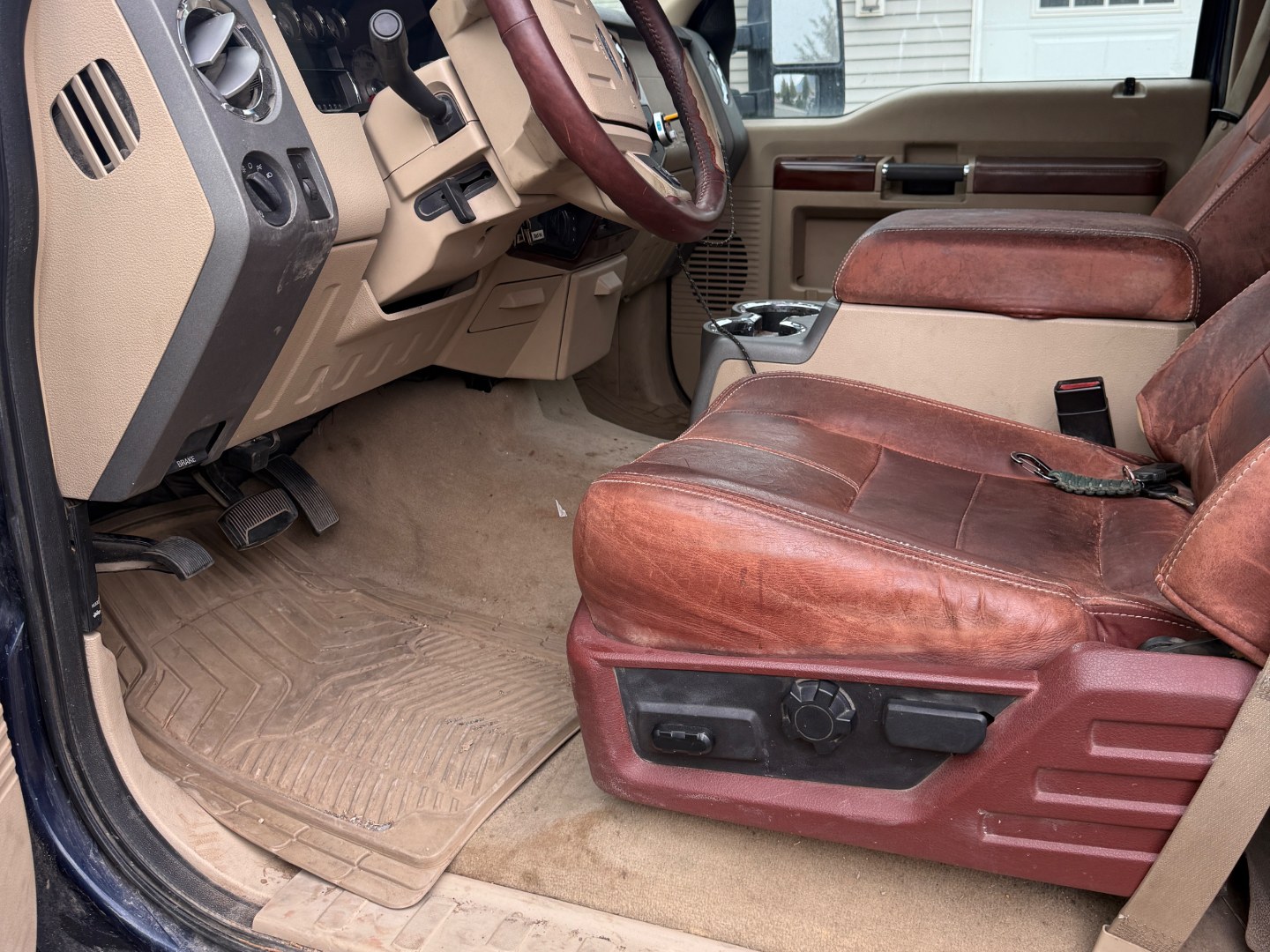 Truck cabin carpet and floor mat before and after shampooing — before