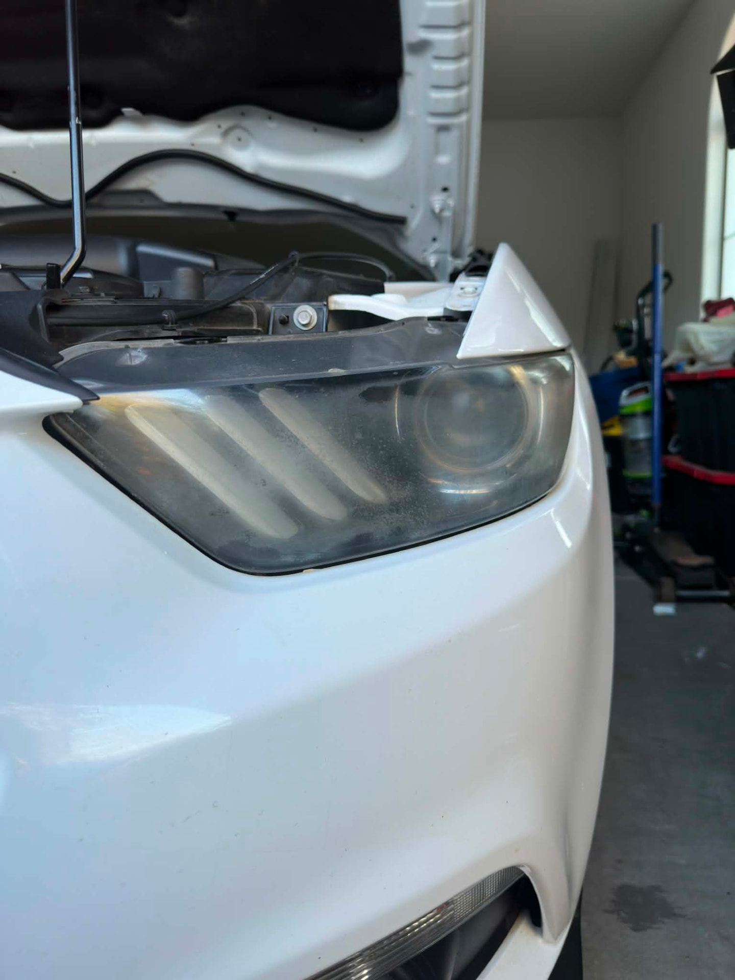Vehicle headlight before and after restoration — before
