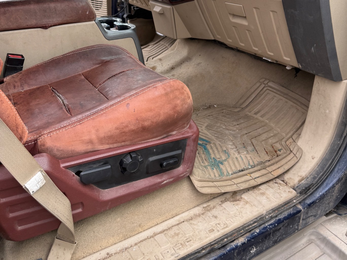 Truck rubber floor mats before and after a deep clean — before