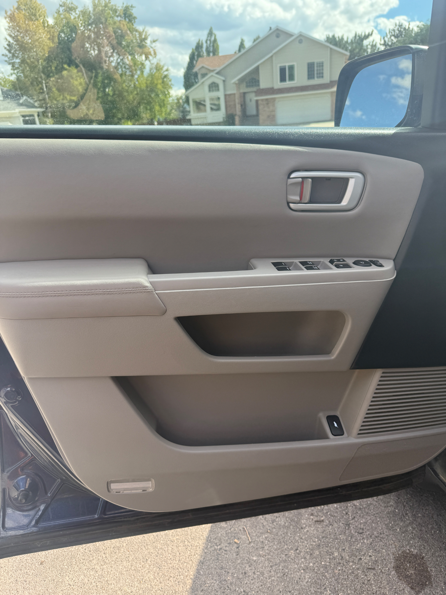 Interior door panel and window switch controls before and after detailing — before