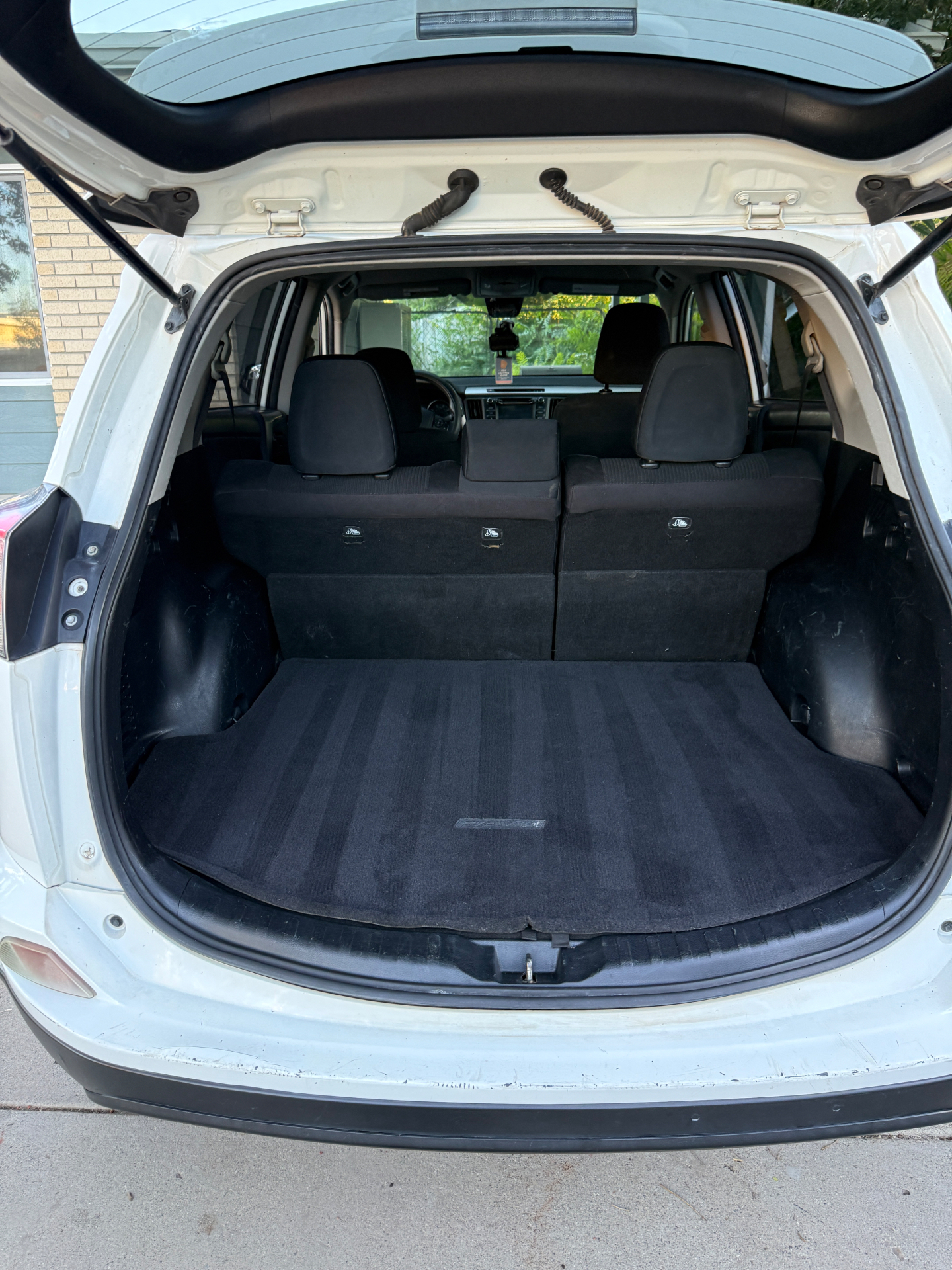Vehicle trunk before and after basic pet hair removal — after