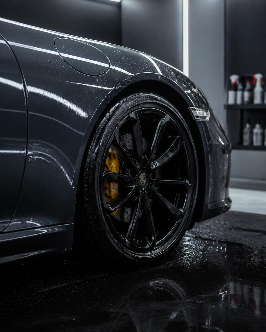 Freshly detailed dark sports car with deep gloss paint after a Gloss Works Detailing mobile appointment